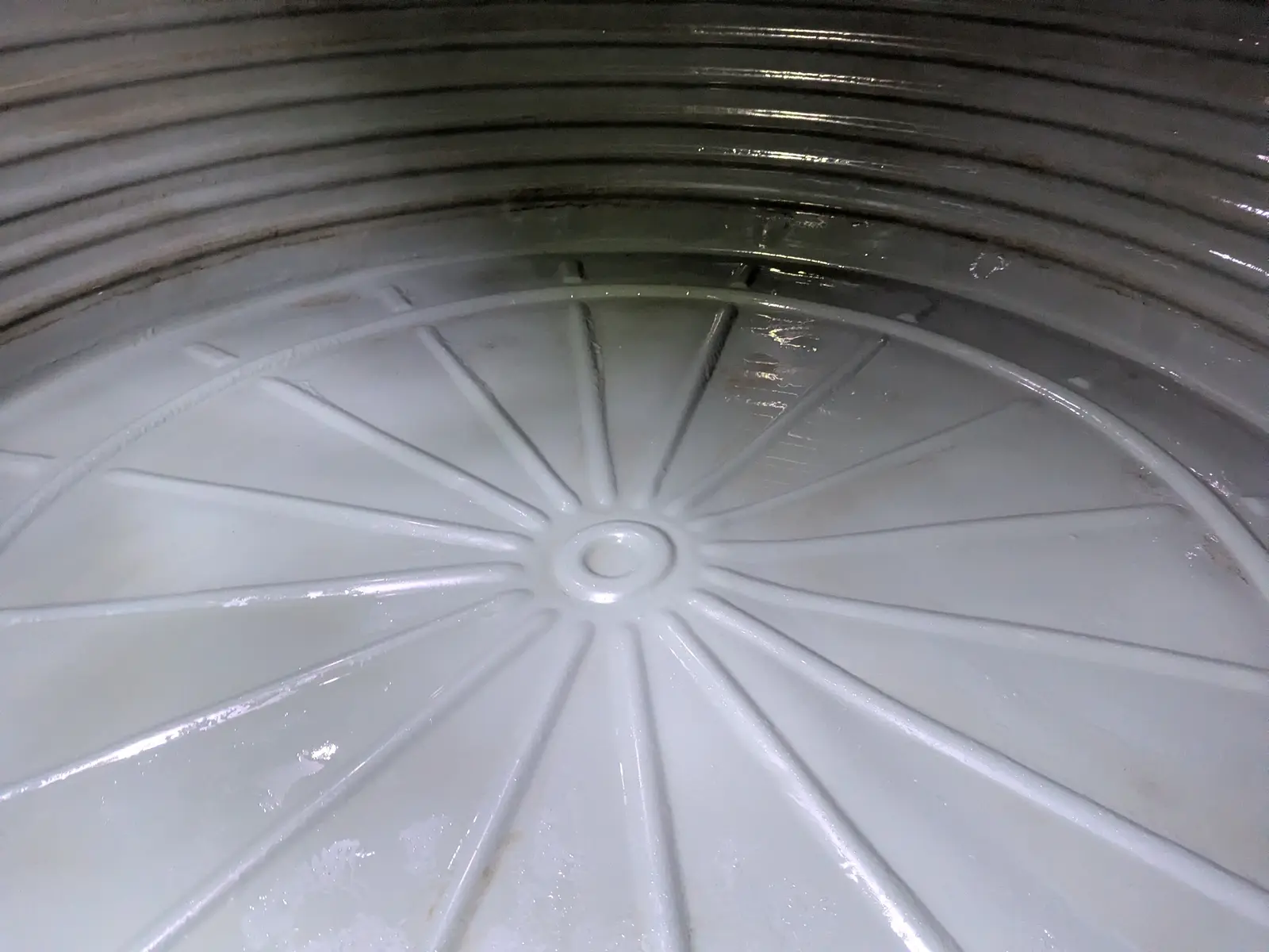 Clean concrete tank floor after vacuum cleaning
