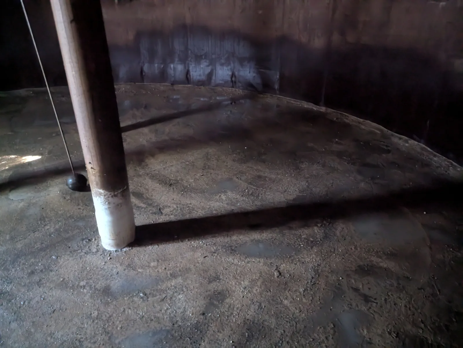 Clean concrete tank floor after the organic matter was vacuumed out